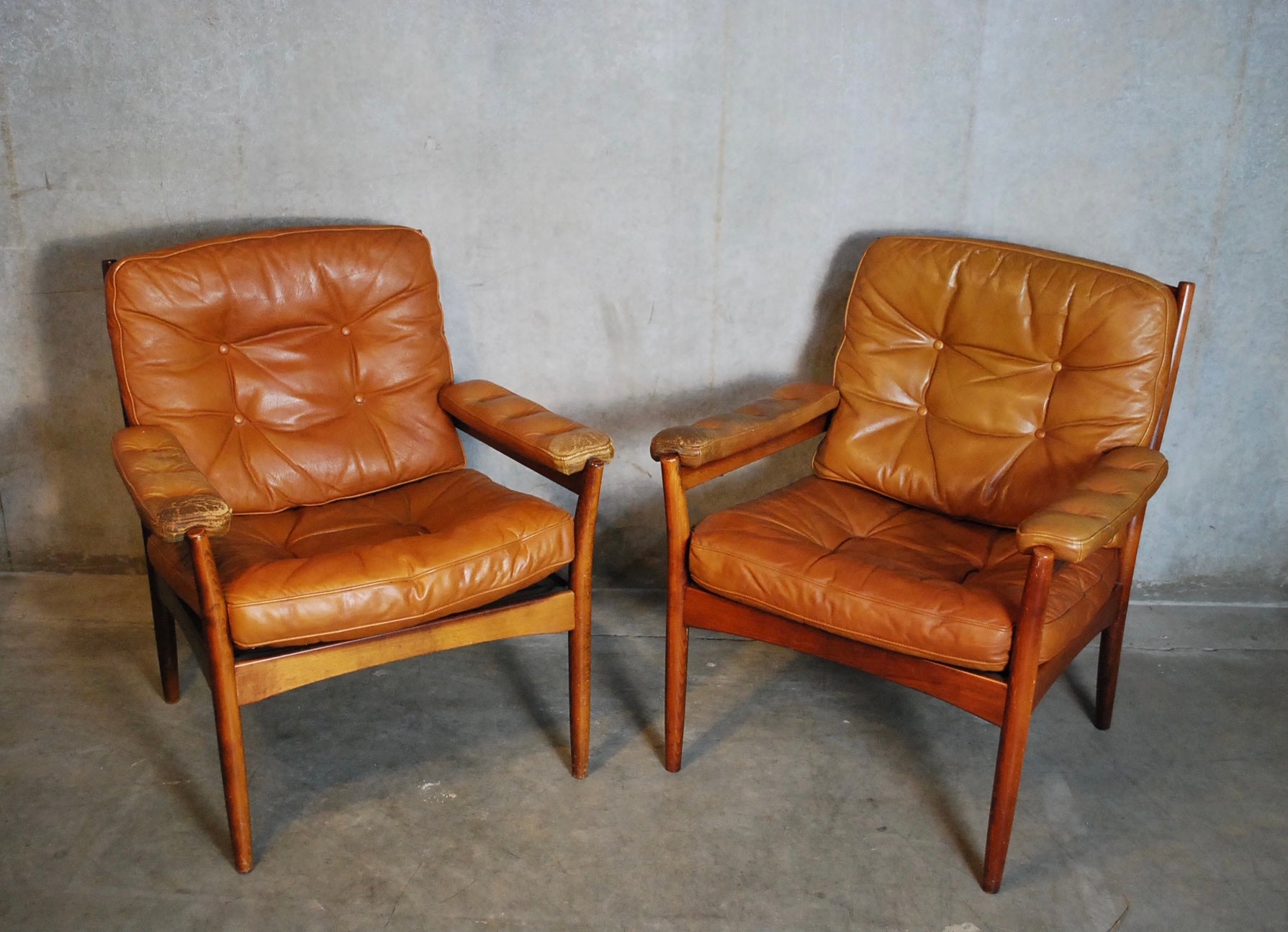 Pair of Mid Century G Nobel Arm Chairs by Nobel in Tufted Leather | Scott Landon Antiques and Interiors.