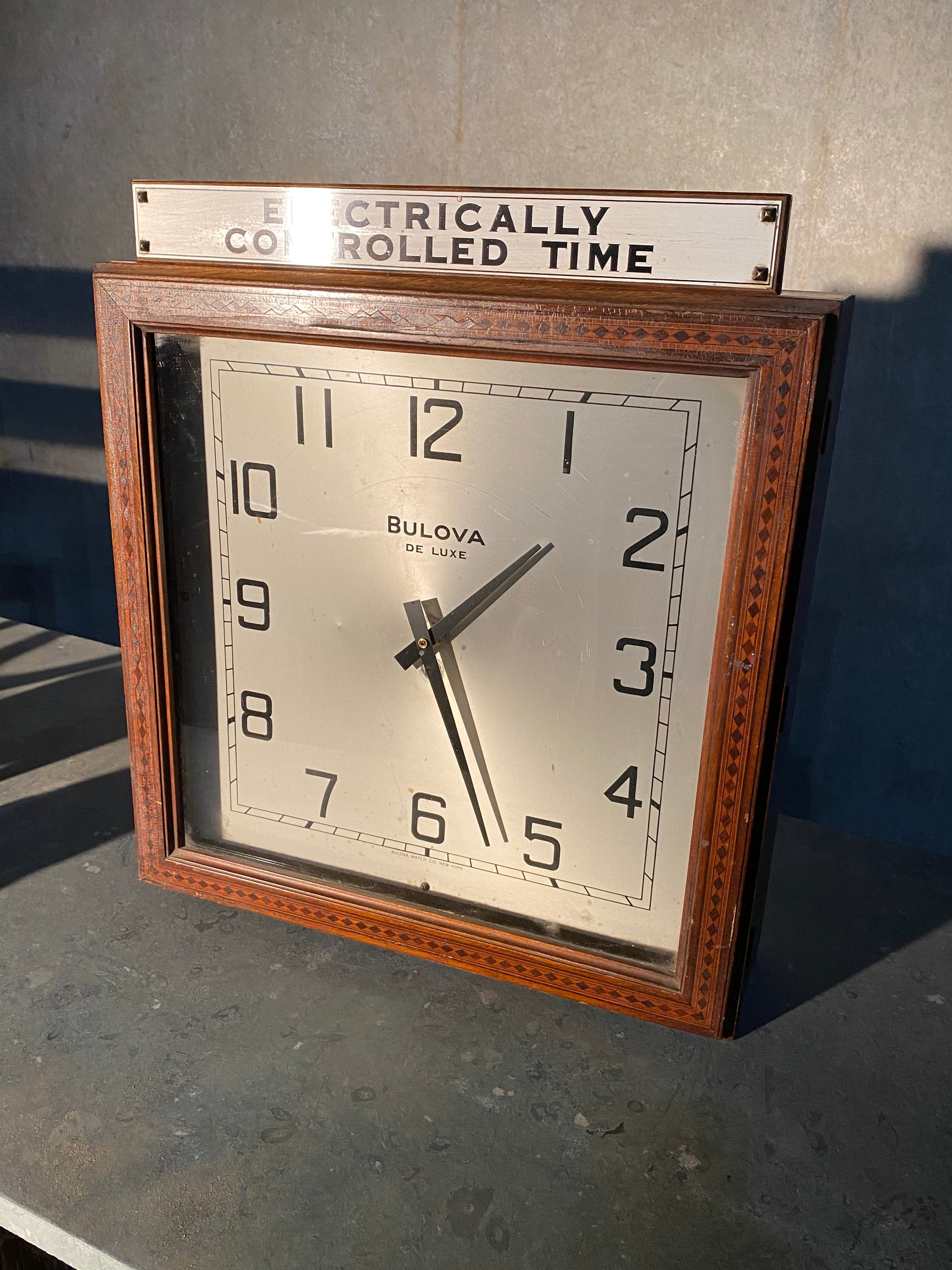 1930  ART DECO  Bulova wall clock store advertising | Scott Landon Antiques and Interiors.