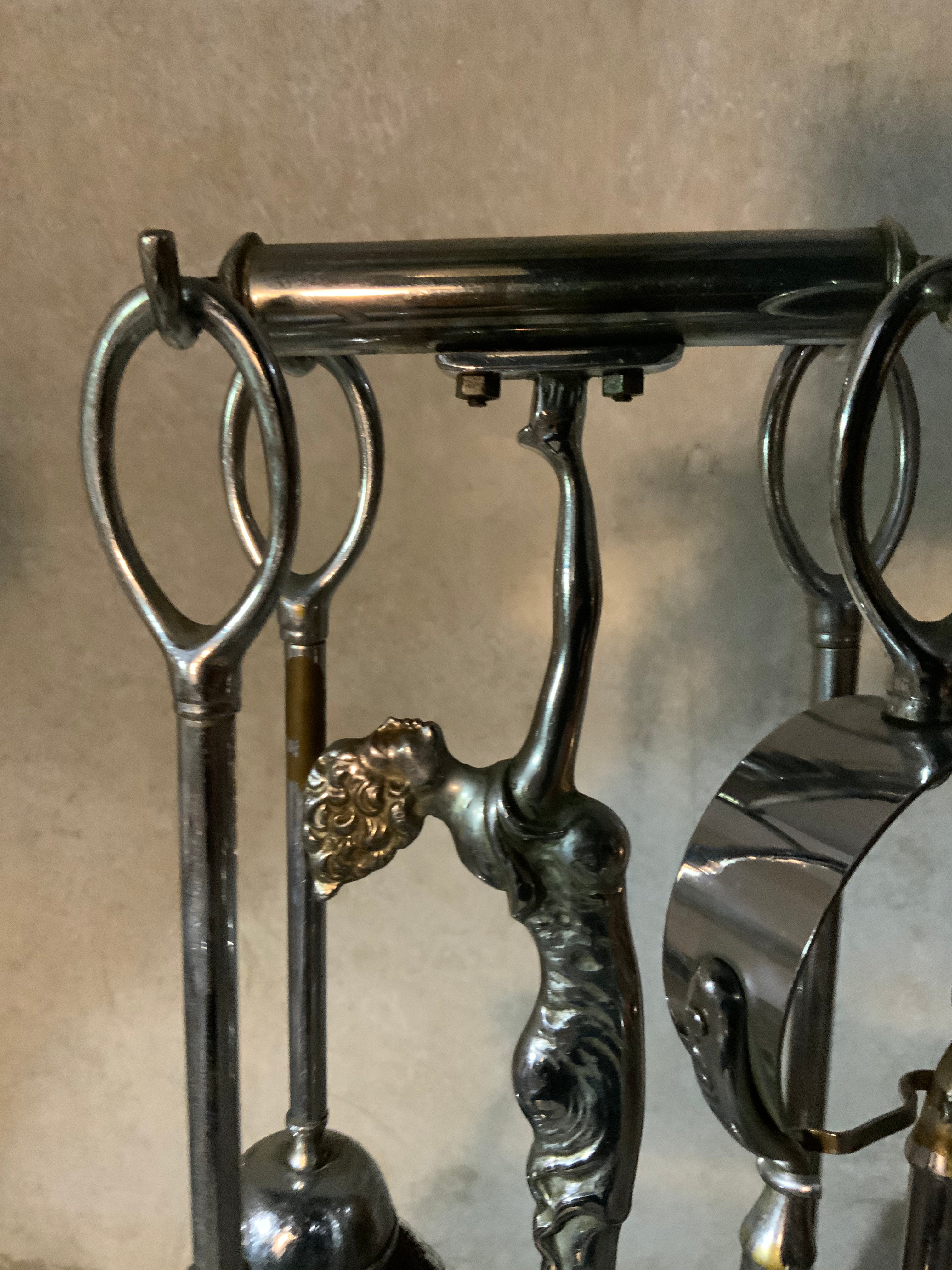 1930 set of figurative. Fireplace tools | Scott Landon Antiques and Interiors.