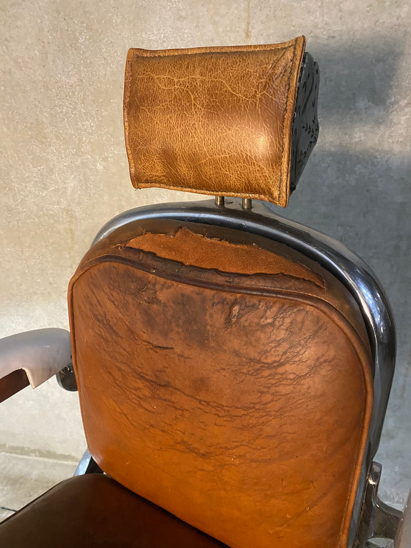 Koken first generation Porcelain barber chair  in old Leather | Scott Landon Antiques and Interiors.