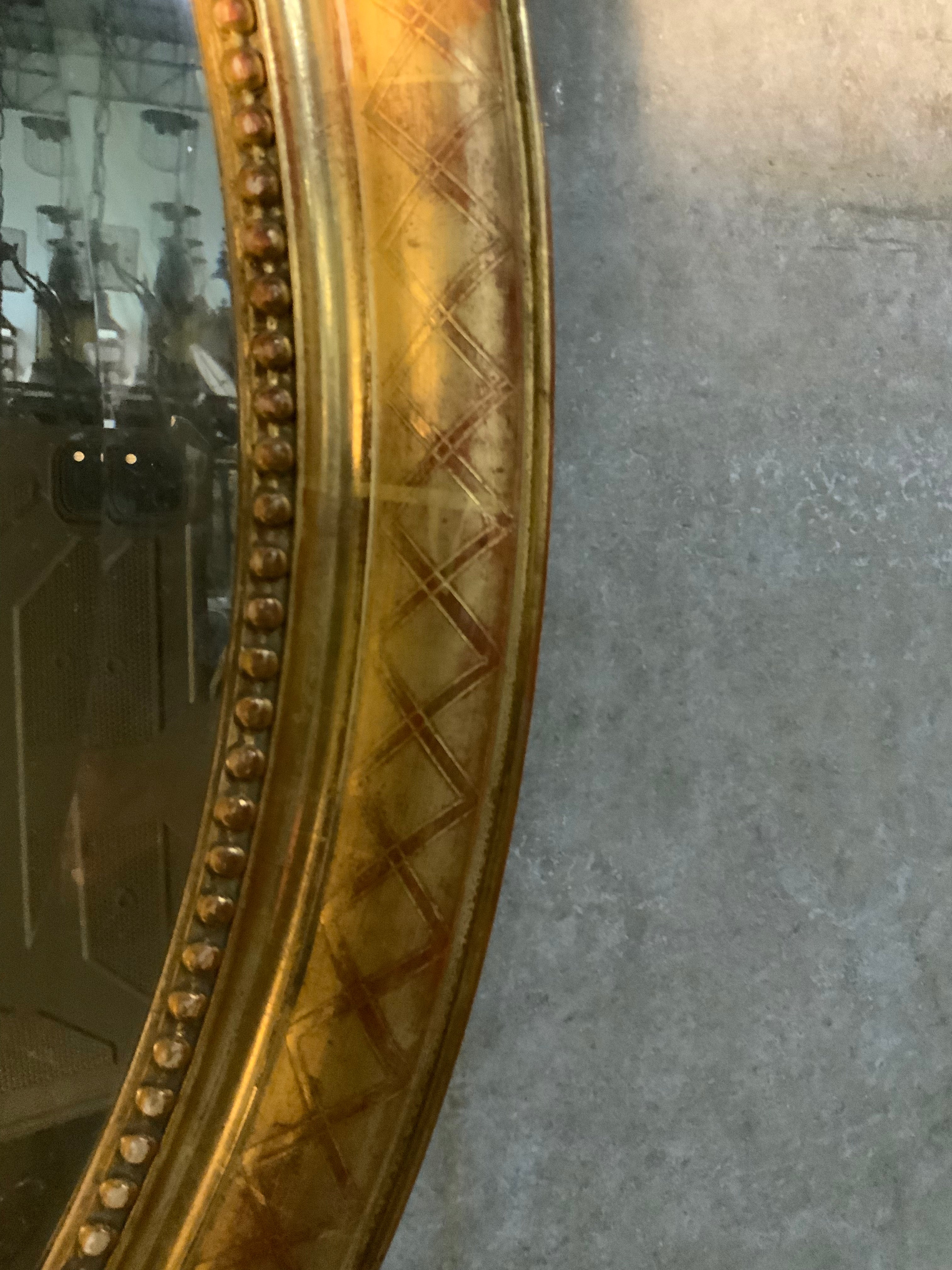 1870 French oval gilded Louis  xvi  beveled mirror | Scott Landon Antiques and Interiors.