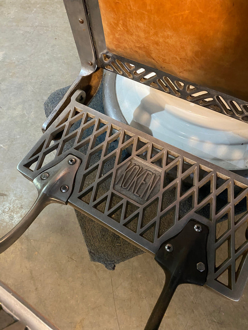 Koken first generation Porcelain barber chair  in old Leather | Scott Landon Antiques and Interiors.