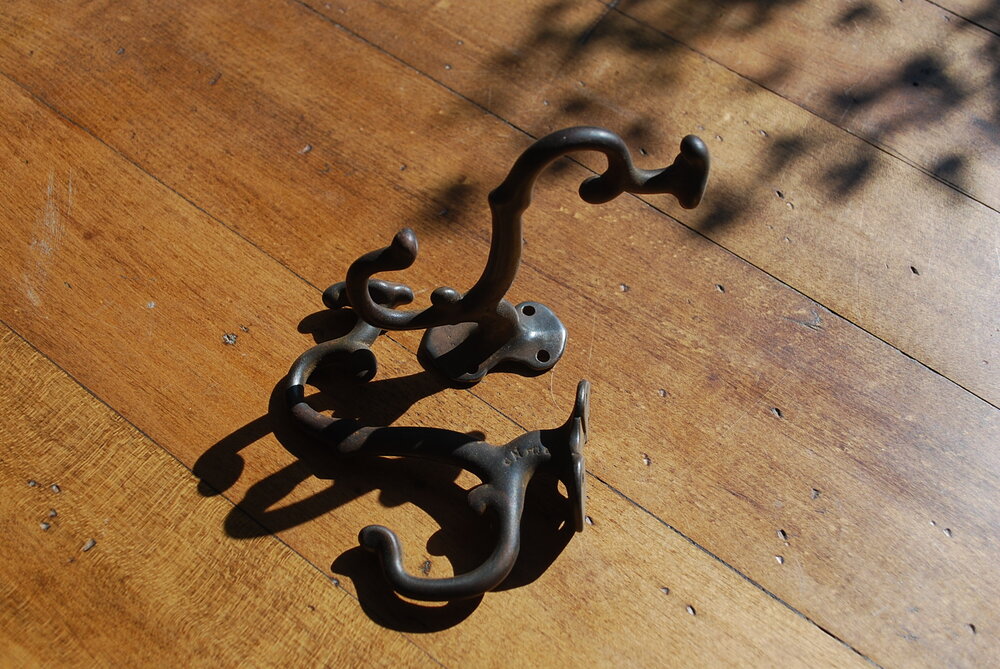 1930 Cast decorative coat hooks | Scott Landon Antiques and Interiors.
