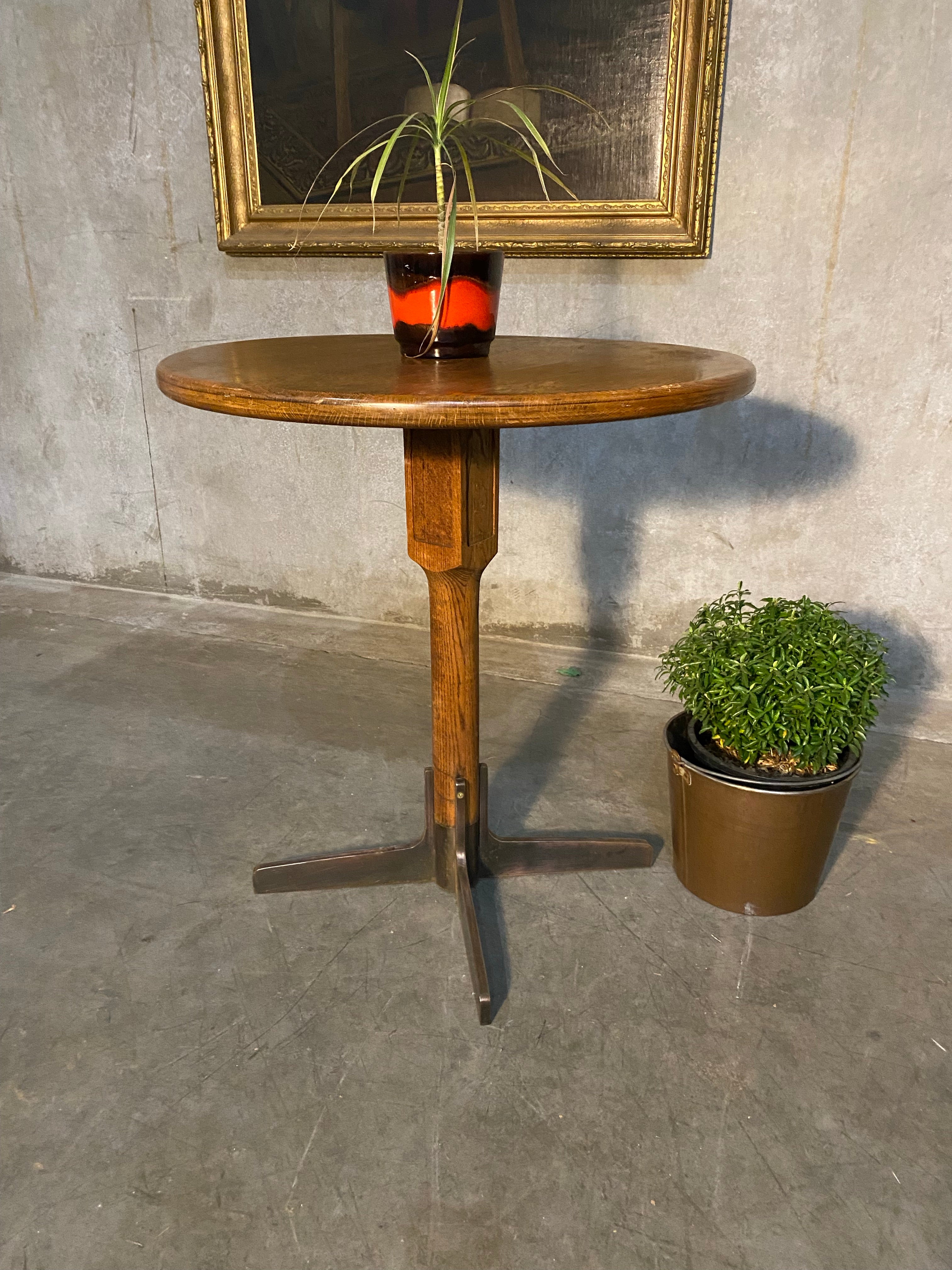 1940 oak pub table with cast iron base | Scott Landon Antiques and Interiors.