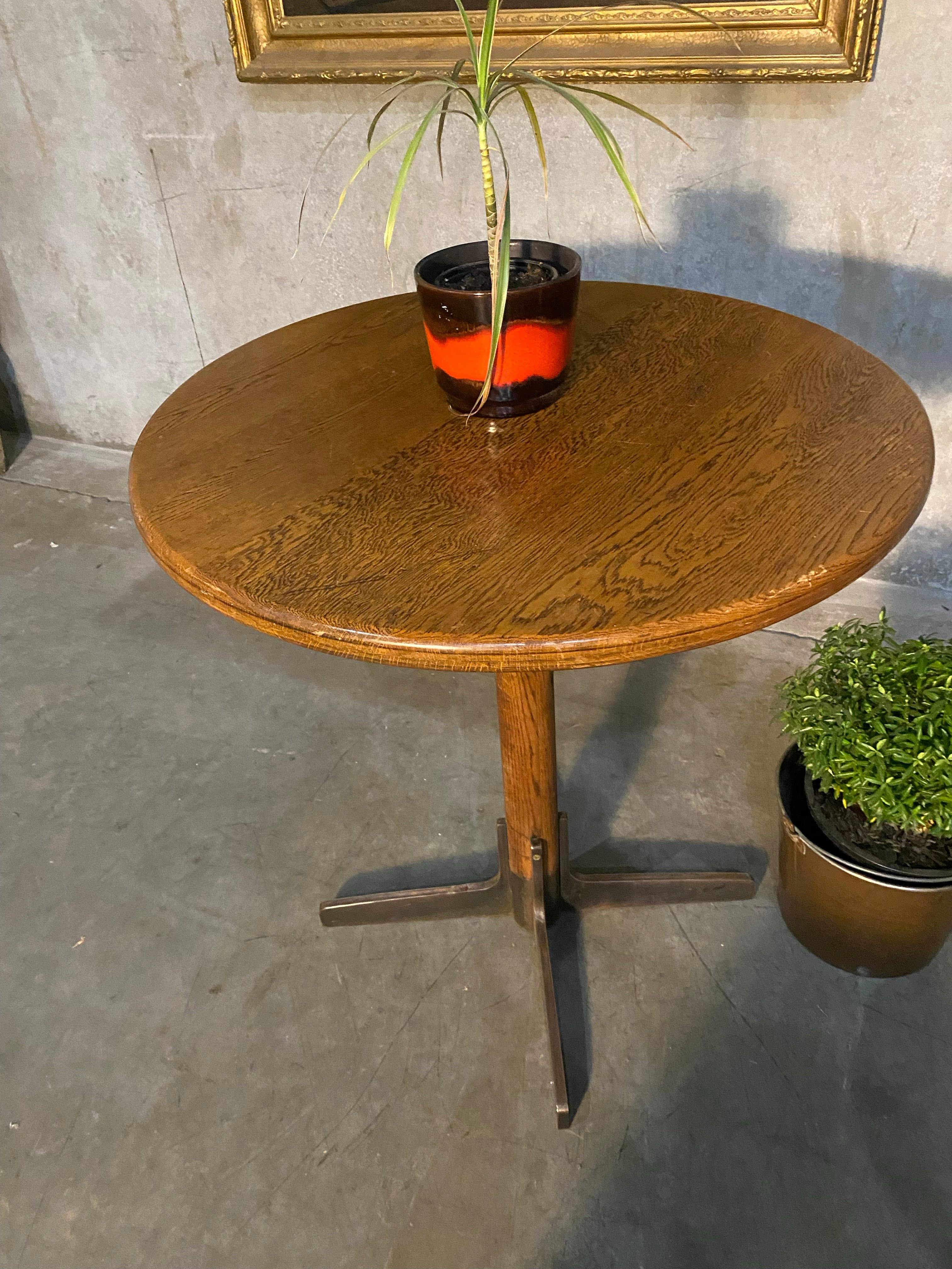 1940 oak pub table with cast iron base | Scott Landon Antiques and Interiors.