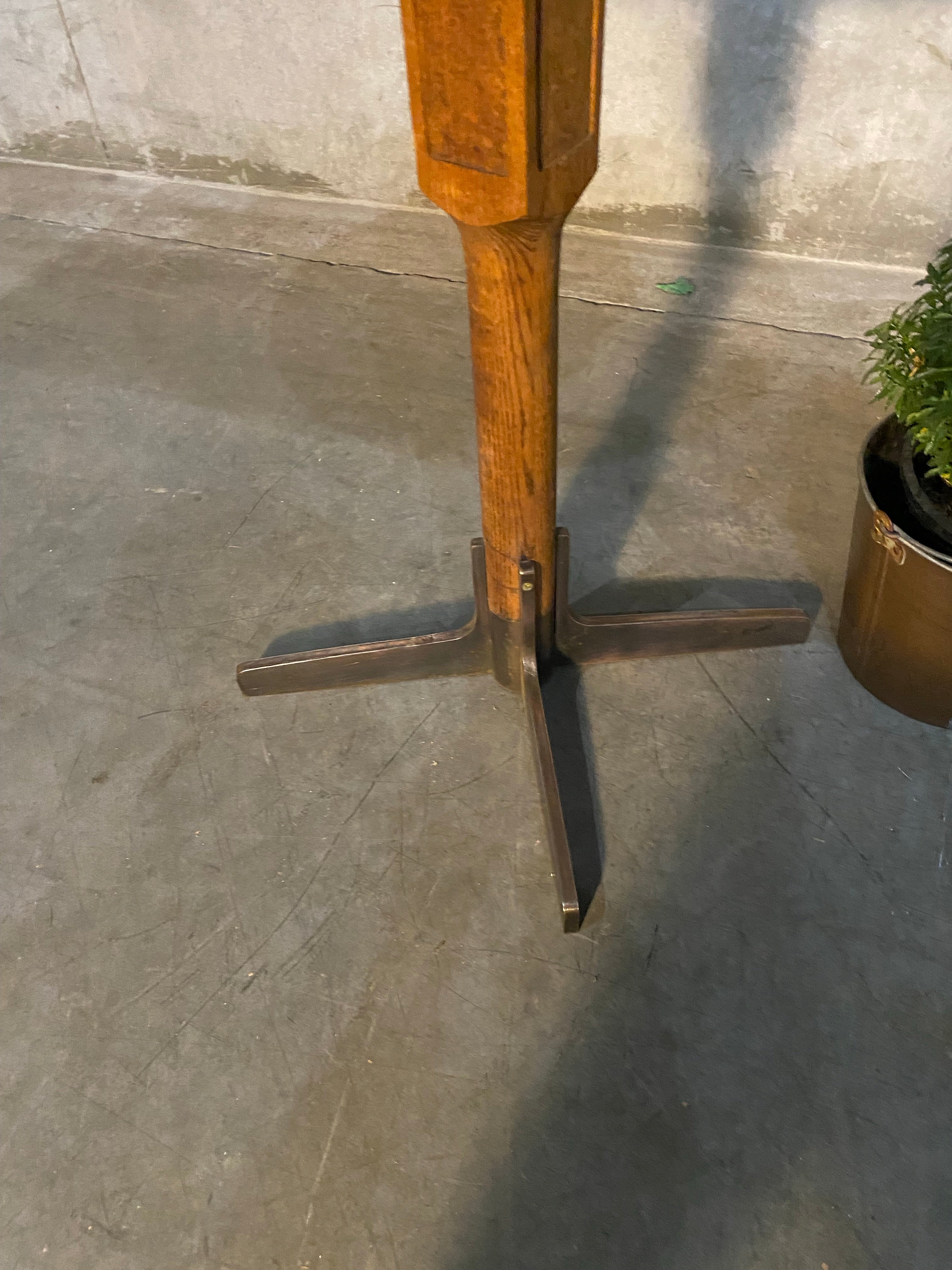 1940 oak pub table with cast iron base | Scott Landon Antiques and Interiors.