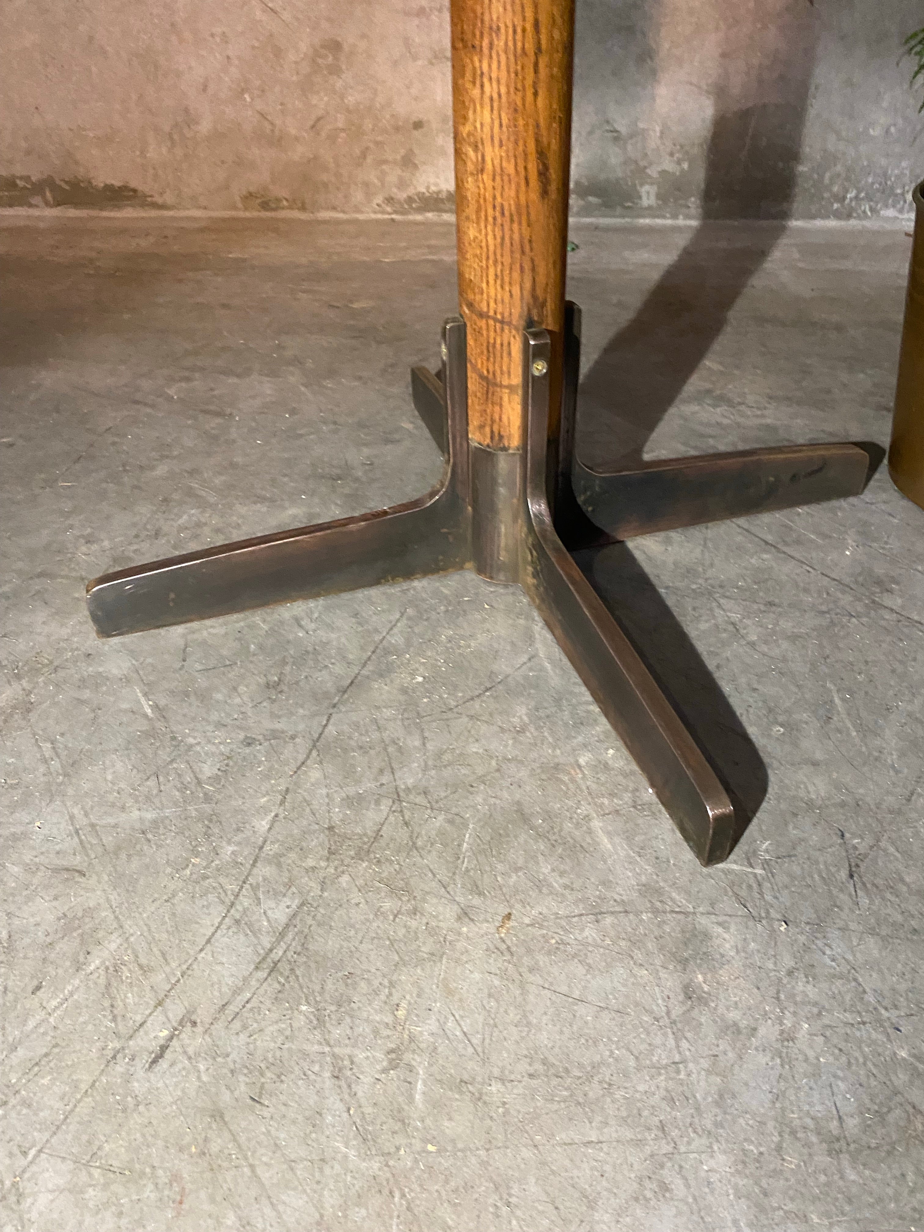1940 oak pub table with cast iron base | Scott Landon Antiques and Interiors.
